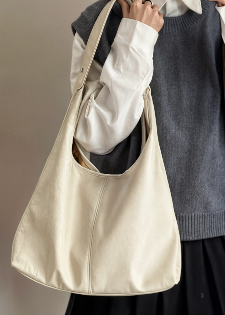Elegant women's vegan leather tote handbag, spacious, vintage design, in brown, perfect for style and practicality.