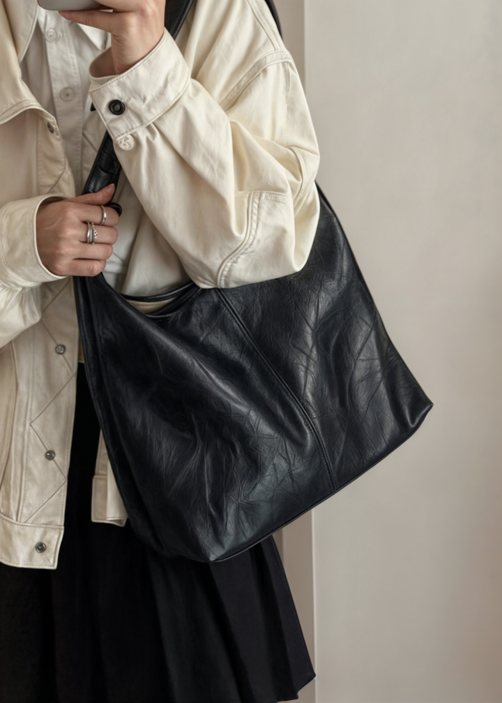 Elegant women's vegan leather tote handbag, spacious, vintage design, in brown, perfect for style and practicality.