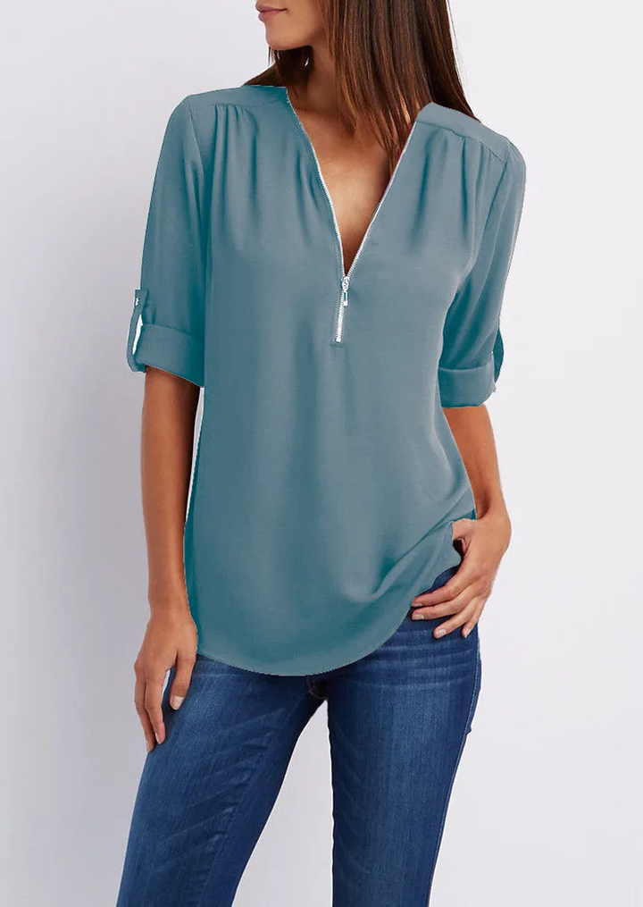 Elegant women's zipper blouse with chic modern design, flattering fit. Perfect for casual or formal occasions.