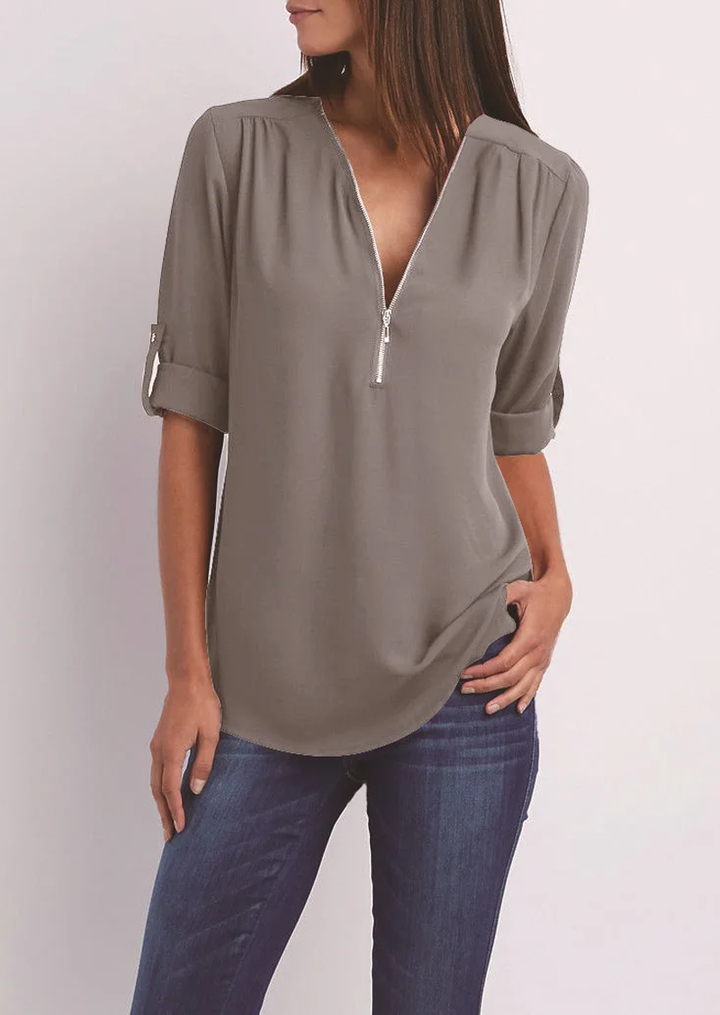 Elegant women's zipper blouse with chic modern design, flattering fit. Perfect for casual or formal occasions.