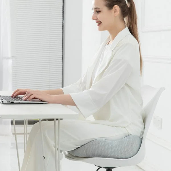 "Ergonomic memory foam sit bone relief cushion for office or car, contoured for tailbone support, adjustable firmness."