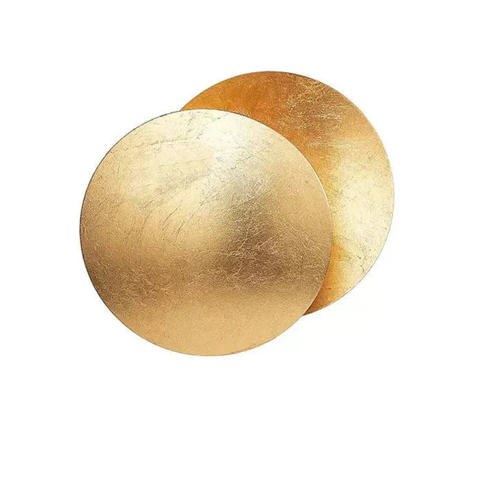 "Golden Solaris Wall Lamp with eclipse-inspired design, featuring elegant gold discs and warm LED glow for home decor."