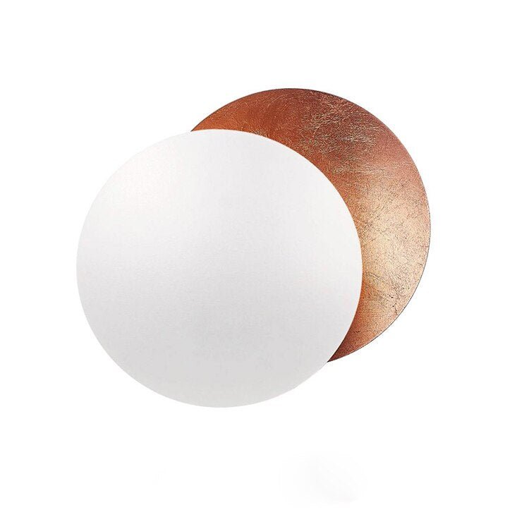 "Golden Solaris Wall Lamp with eclipse-inspired design, featuring elegant gold discs and warm LED glow for home decor."