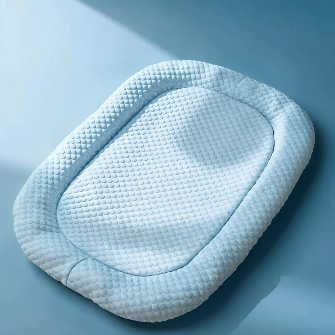"Ice-silk cooling pet bed, soft blue with smooth texture, ideal for hot weather. Comfortable, breathable, and pet-friendly."