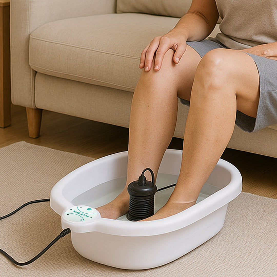"Ionic Foot Spa for Relaxation & Detox, white plastic tub with water, offers detoxification and tranquility at home."