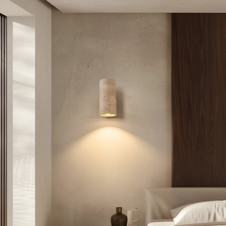 Japandi minimalist travertine stone wall lamp with natural beige finish, conveys elegance with its sleek design and warm glow