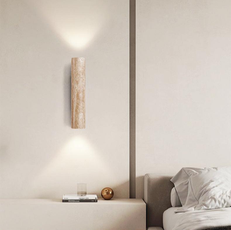 Japandi minimalist travertine stone wall lamp with natural beige finish, conveys elegance with its sleek design and warm glow