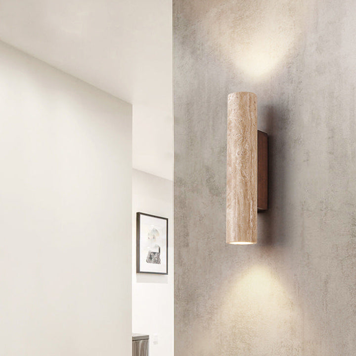 Japandi minimalist travertine stone wall lamp with natural beige finish, conveys elegance with its sleek design and warm glow
