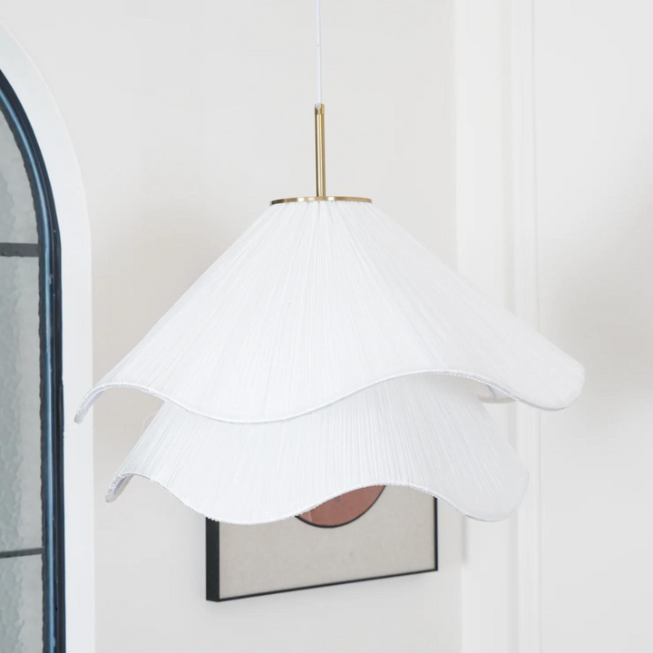 "Japandi pendant light with fabric shade, iron frame, warm ambient glow; modern elegant design for diverse interiors."