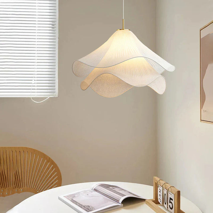 "Japandi pendant light with fabric shade, iron frame, warm ambient glow; modern elegant design for diverse interiors."