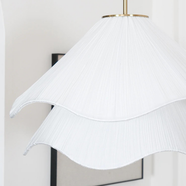 "Japandi pendant light with fabric shade, iron frame, warm ambient glow; modern elegant design for diverse interiors."