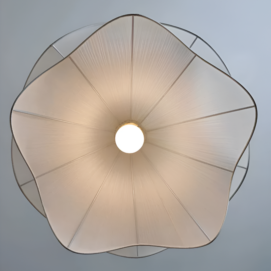 "Japandi pendant light with fabric shade, iron frame, warm ambient glow; modern elegant design for diverse interiors."