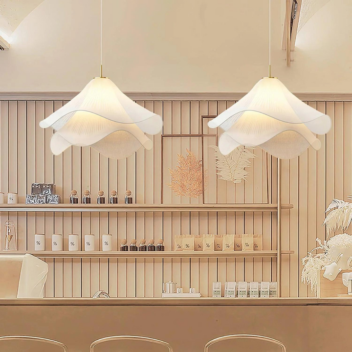 "Japandi pendant light with fabric shade, iron frame, warm ambient glow; modern elegant design for diverse interiors."
