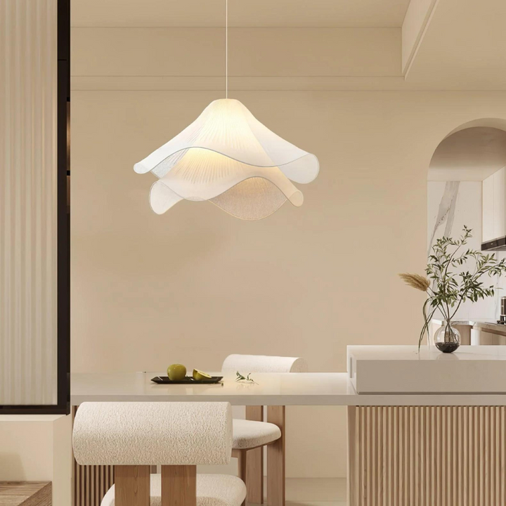 "Japandi pendant light with fabric shade, iron frame, warm ambient glow; modern elegant design for diverse interiors."