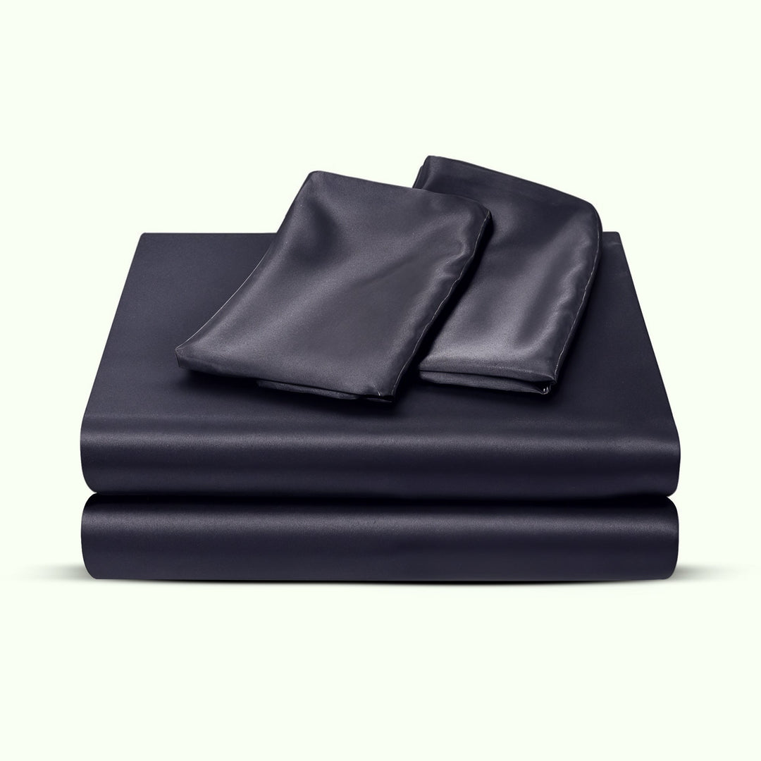 "Luxurious full size satin sheets with deep pockets, silky sheen in elegant colors, draped beautifully on a bed."