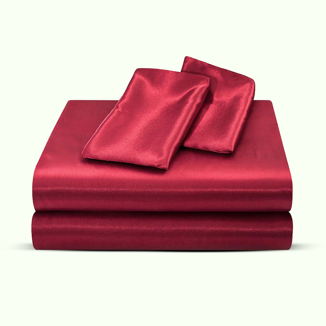 "Luxurious full size satin sheets with deep pockets, silky sheen in elegant colors, draped beautifully on a bed."