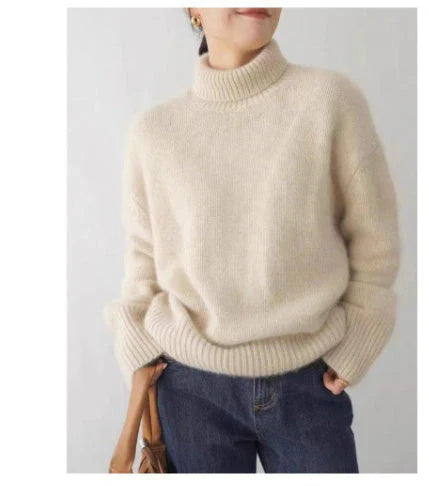 Luxurious women's cashmere turtleneck sweater, classic design, soft texture, warm, ideal for elegant winter outfits.