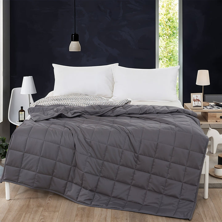 "Luxury weighted blanket with soft texture in blue and grey, designed for relaxation and enhancing sleep quality."