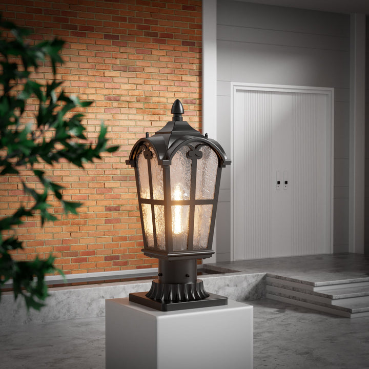 Matt black outdoor post light with clear glass shade, elegant design, perfect for gardens, pathways, or entryways.