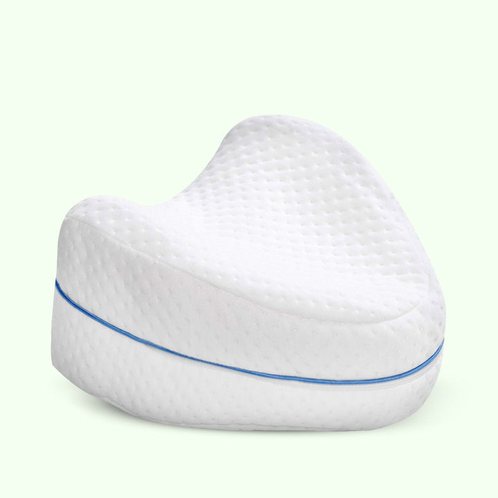 "Memory foam leg and knee support pillow in grey, pink, and white for pain relief, shown in various color options."