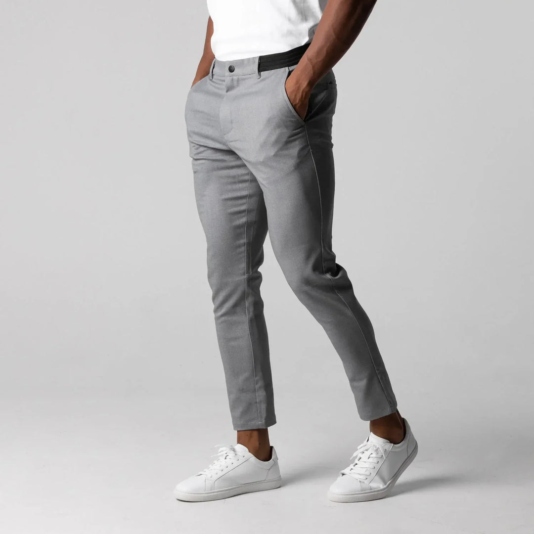 Men's modern tapered chino pants in neutral tones, front view showcasing a stylish, streamlined fit with functional pockets.