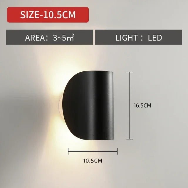 Modern LED up-down wall sconce light in black and white with minimalist design, perfect for indoor ambient lighting.