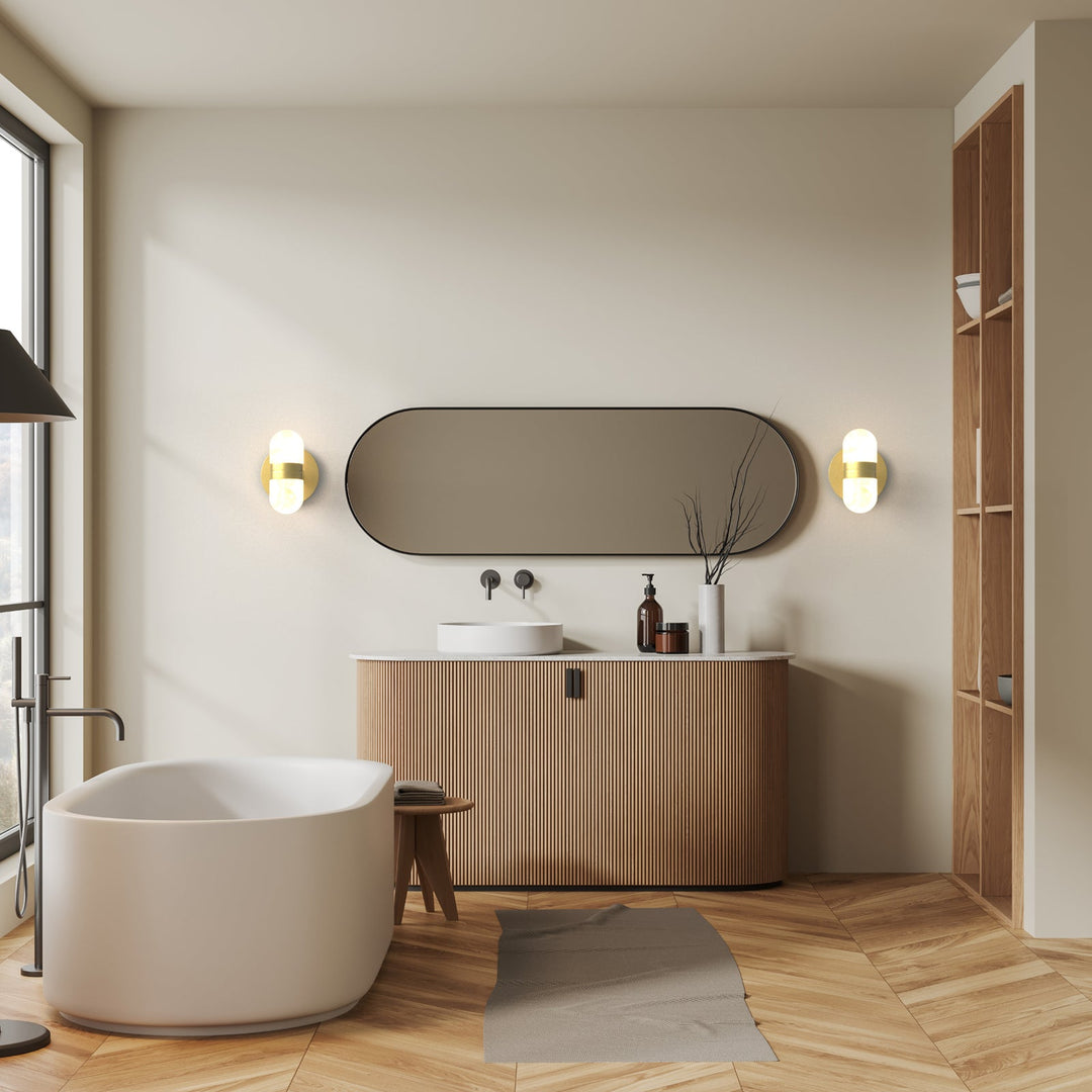 Modern brass wall lamp featuring snow-white alabaster shades with brown veining; elegant indoor lighting fixture.