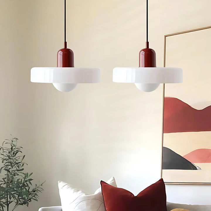 "Modern glass pendant light with sleek glass, brushed metal, ideal for elegant interiors, adds sophistication and warmth."
