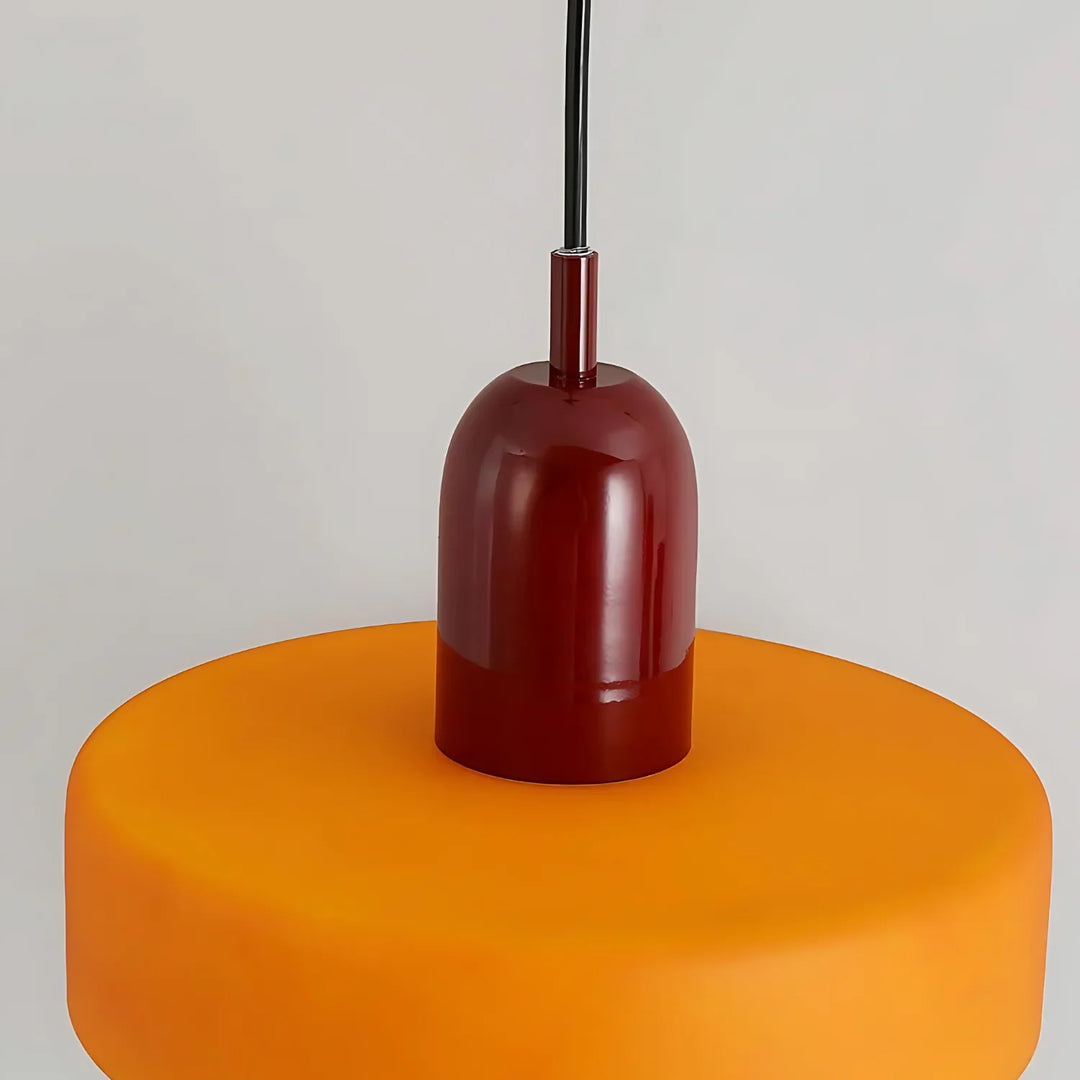 "Modern glass pendant light with sleek glass, brushed metal, ideal for elegant interiors, adds sophistication and warmth."