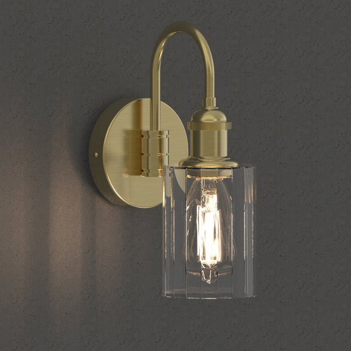 Modern glass wall light with metal frame, glass shade; E27 bulb holder; side profile; elegant design for interior spaces.