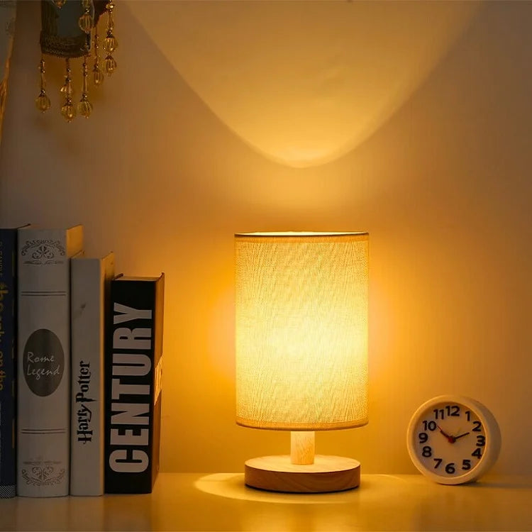 "Modern wooden bedside table lamp with remote, dimmable LED, natural wood look, elegant design for bedroom or living room."