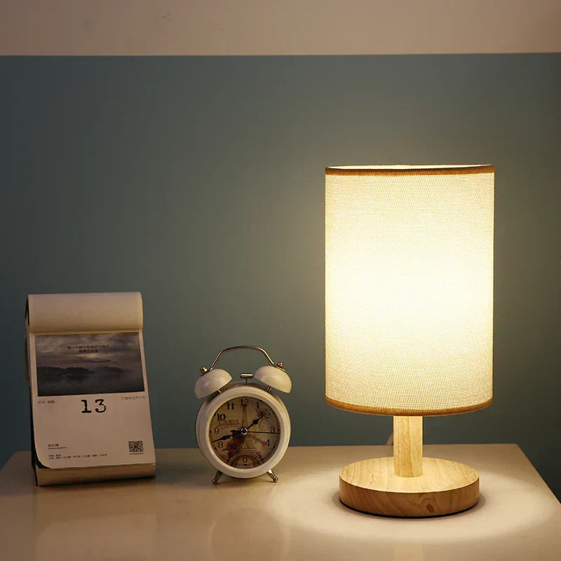 "Modern wooden bedside table lamp with remote, dimmable LED, natural wood look, elegant design for bedroom or living room."