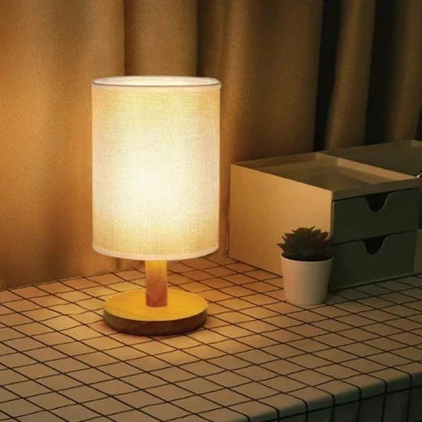 "Modern wooden bedside table lamp with remote, dimmable LED, natural wood look, elegant design for bedroom or living room."