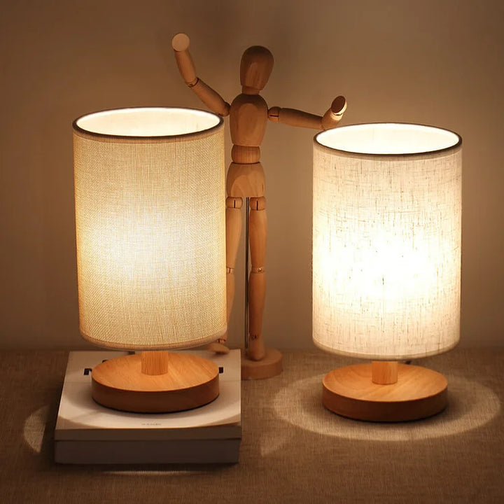 "Modern wooden bedside table lamp with remote, dimmable LED, natural wood look, elegant design for bedroom or living room."