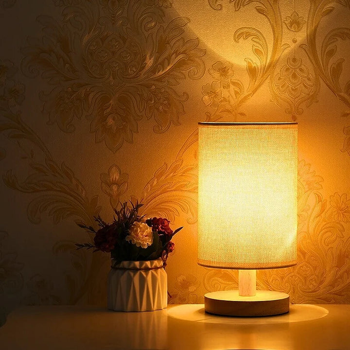"Modern wooden bedside table lamp with remote, dimmable LED, natural wood look, elegant design for bedroom or living room."