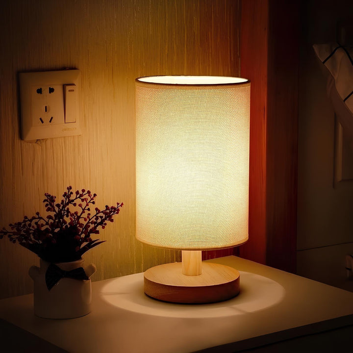 "Modern wooden bedside table lamp with remote, dimmable LED, natural wood look, elegant design for bedroom or living room."