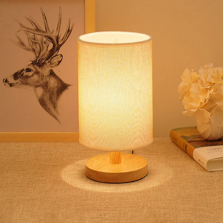 "Modern wooden bedside table lamp with remote, dimmable LED, natural wood look, elegant design for bedroom or living room."