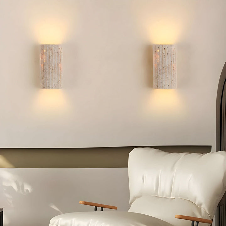 "Natural stone wall lamp with warm LED glow, showcasing organic texture and ambient lighting for modern interiors."