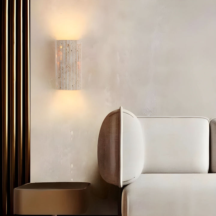 "Natural stone wall lamp with warm LED glow, showcasing organic texture and ambient lighting for modern interiors."
