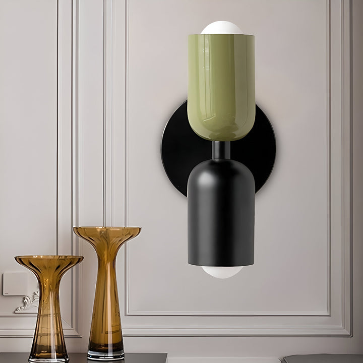 Nordic colourful double head wall light in vibrant colors, painted iron, sleek cylindrical design, casts light up and down.