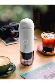 Portable electric espresso machine with USB-C, black, compact, features sleek design, perfect for travel, uses capsules/groun