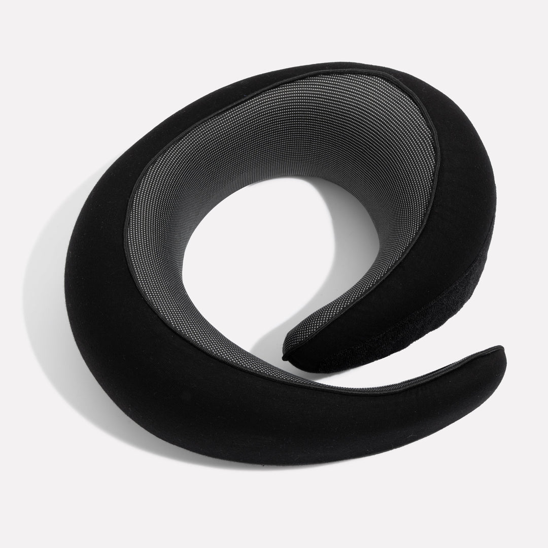 "Premium memory foam travel pillow, ergonomic neck support, sleek design, ideal for unisex comfort on-the-go."