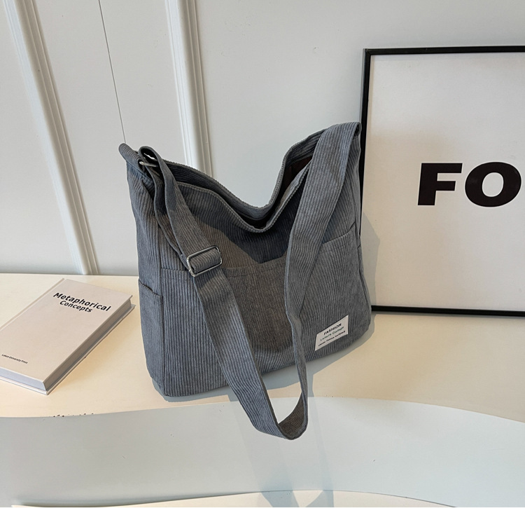 Ribbed velvet shoulder bag in beige, black, brown, green, grey with spacious interior for stylish, organized essentials.