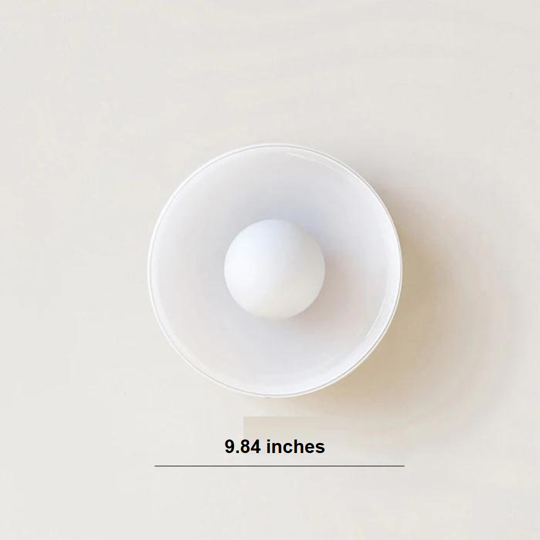 "Round ceiling lamp of high-quality glass in vibrant orange, stylish design, perfect for modern interiors, enhancing any spac