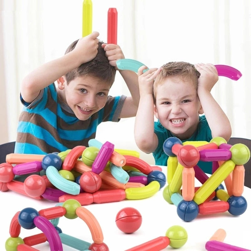 Set of colorful magnetic building blocks for kids, designed to create various shapes and encourage creative play.