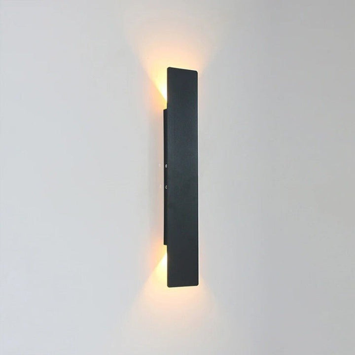 "Sleek black weatherproof LED wall light for outdoor use, featuring modern design and durable aluminum construction."