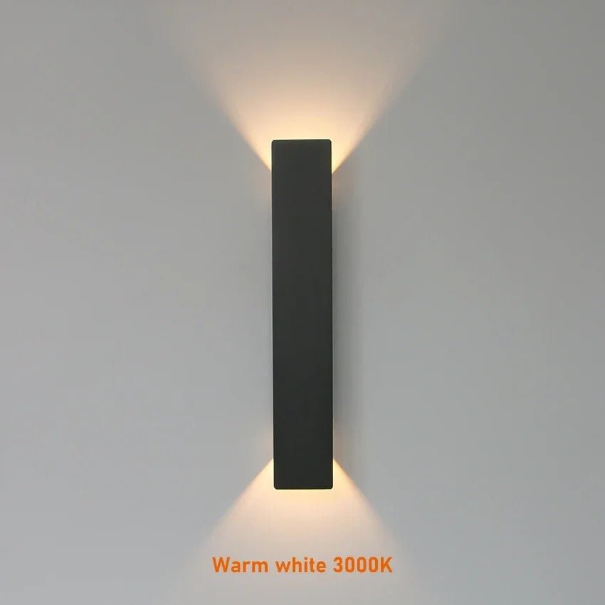 "Sleek black weatherproof LED wall light for outdoor use, featuring modern design and durable aluminum construction."