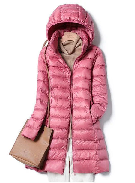 "Stylish women's long hooded puffer jacket with quilted design and extended length for warmth and protection in winter."