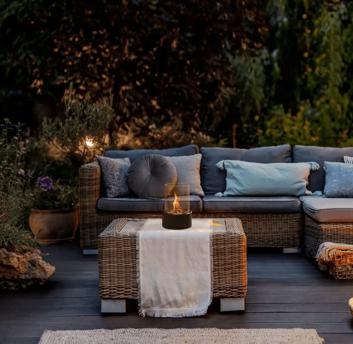 "Tabletop Portable Fire Pit with marble base, glass cylinder, sleek modern design, ideal for indoor and outdoor ambiance."