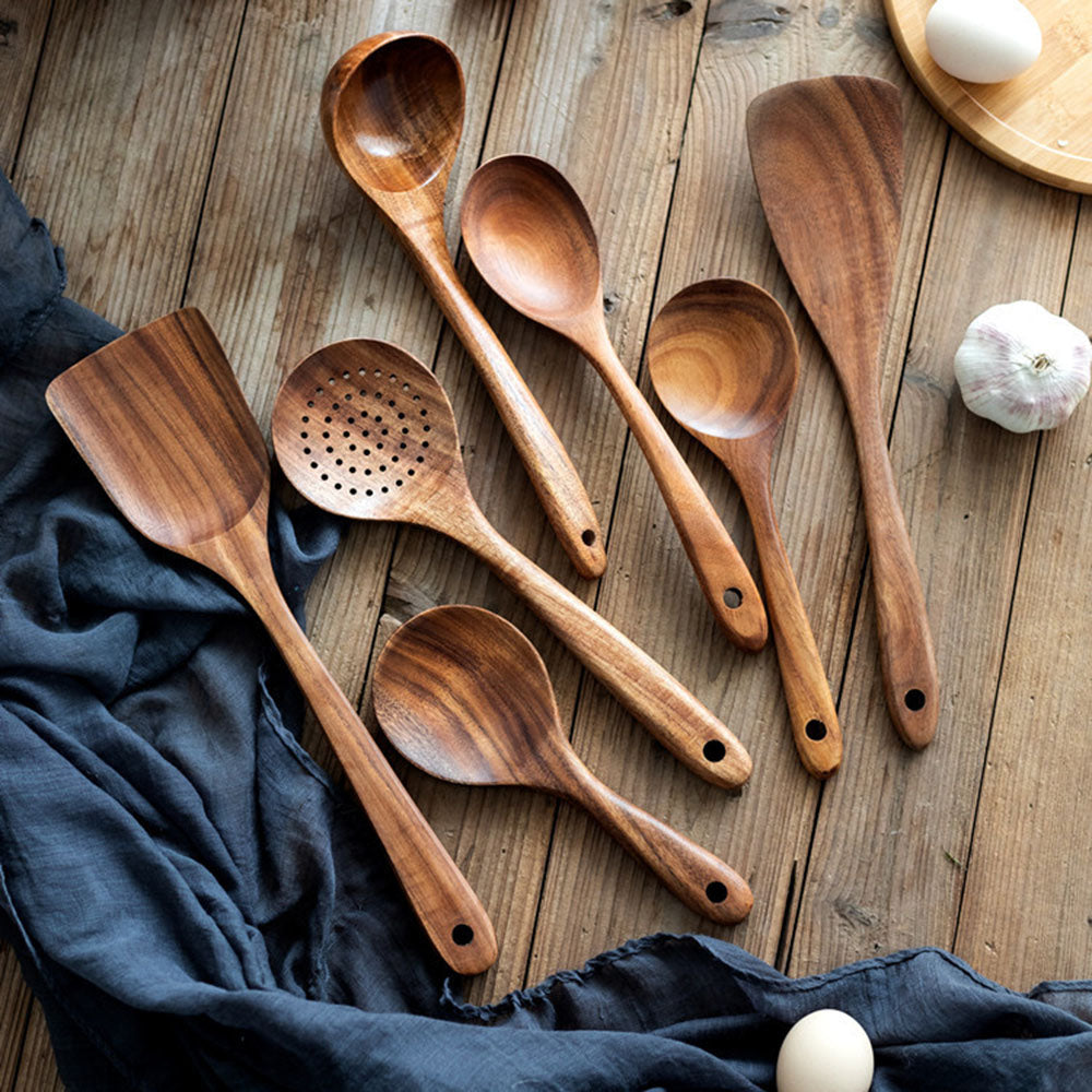 "Teak wood kitchen utensil set with non-scratch, polished finish; includes spoon, spatula, and colander, elegant design."